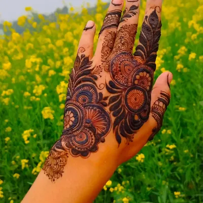 A classic Arabic design with bold floral and paisley motifs against a field of yellow flowers. The contrast is just beautiful.