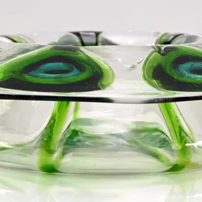 This Bohemian glass bowl, decorated with a 'Peacock Feather' pattern after a design by Loetz, was the lead lot in my 'Ostentatious Peacocks' auction. The inverted capstan form and vibrant green glass make it a stunning decorative piece.