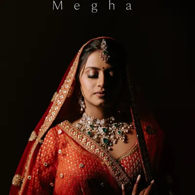 A breathtaking bridal portrait. The dramatic lighting and her serene expression create a powerful and timeless image, capturing the essence of her beauty on her wedding day.