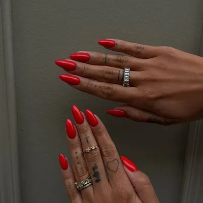 A classic, bold red on sharp stiletto nails. This look is confident, powerful, and always makes a statement.