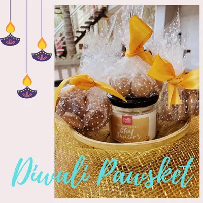 Our Diwali 'Pawsket' beautifully arranged. It includes a jar of peanut butter and bags of our two different cookie flavors, all ready for gifting.