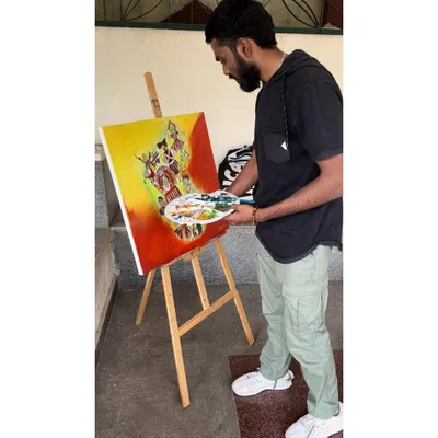 Here I am working on an acrylic painting on canvas for a competition. The theme was 'Karnataka Janapada Kalegalu' (Folk Arts of Karnataka).