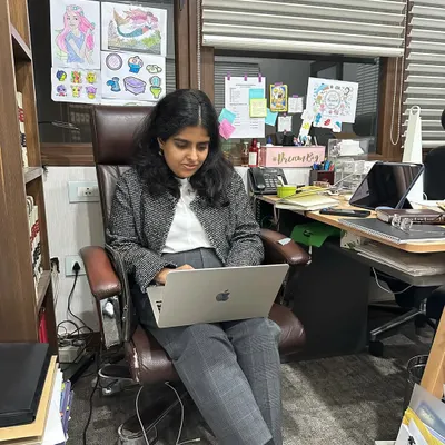 A candid moment at my desk, which is my very sacred, messy, and disorganized space. It's filled with case files, personal touches, and the focused energy of a litigator at work.