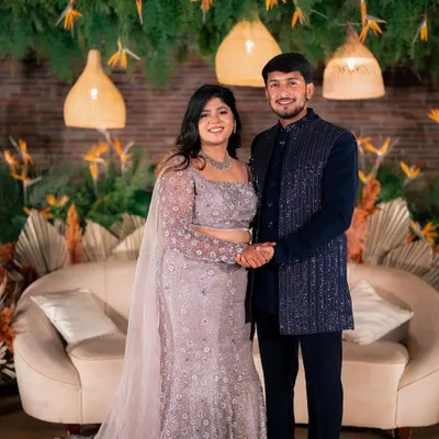 A happy moment for Yeshaswini and Shashank at their boho-chic engagement. The couple's joy is the centerpiece, beautifully framed by our decor of hanging greenery, cane lanterns, and dried palms.