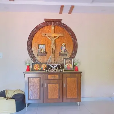 This is the 'before' shot of a living room altar space. A plain wall like this is a perfect canvas, holding the potential to become a deeply personal and artistic centerpiece for the family's home.