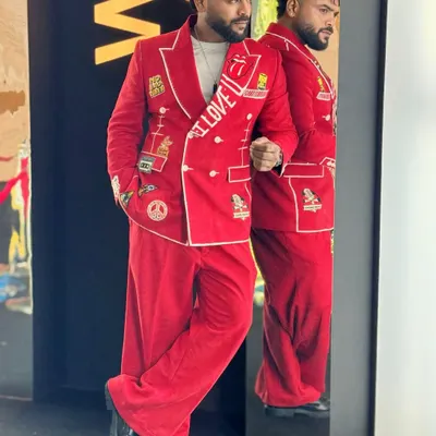 My custom red suit, designed to make a statement at the WOW Awards. The patches and embroidery reflect my personality.