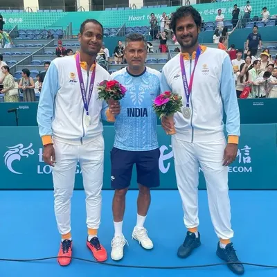 A proud moment for Indian tennis. I stand with our Asian Games silver medalists, Ramkumar Ramanathan and Saketh Myneni, after their hard-fought men's doubles final. This is the level of excellence we strive for at NTC.