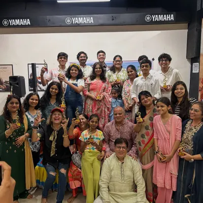 Our happy tribe. A group photo with all our performers and their trophies after a successful music event. This is the result of hard work, dedication, and a lot of taaliyan.