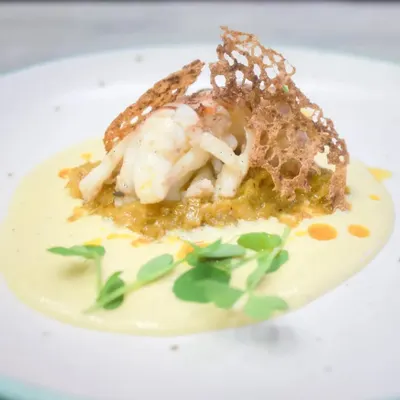 The epitome of fine dining, our confit lobster tail is served on a bed of saffron leek fondue with a corn and lemongrass velouté. This dish showcases our commitment to creating meticulously plated culinary creations for your special events.