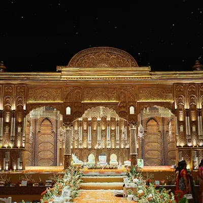 The full view of our South Indian wedding mandap, a 50-foot structure with every part intricately carved by artisans from Karnataka. This is tradition, elevated with our unique design language.