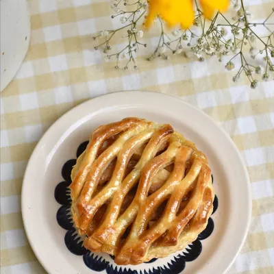 An Apple Pie with a beautiful lattice crust, a classic comfort dessert that we love to make for our weekend specials.