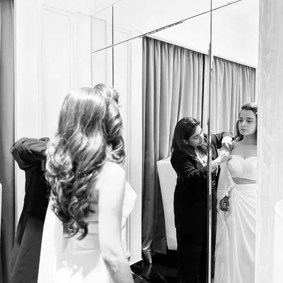 The styling journey in action. Here I am during a fitting with the bride, Aashvi, making sure every detail of her Amit Aggarwal gown is absolutely perfect. This collaborative process is my favorite part.