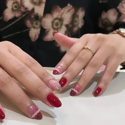 A festive red and pink set with glitter and pearl-like dot accents.