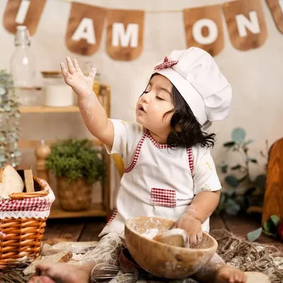 This little baker is celebrating one year by making a glorious mess. The rustic chef theme is a fantastic and fun alternative to a traditional cake smash.
