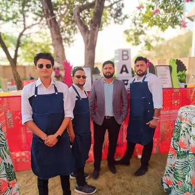Our professional bartending team, dressed in smart uniforms, ready to serve at a beautiful destination wedding. We ensure our staff is as well-presented as our bar setups.