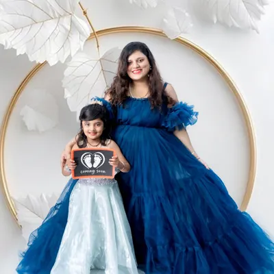 A beautiful maternity portrait with a soon-to-be big sister. It's a joy to capture the excitement of the whole family as they wait for the new arrival.