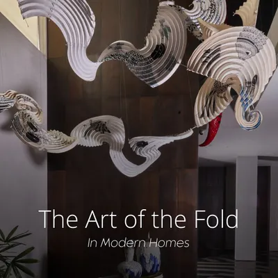 This installation, created with artist Ankon Mitra, showcases how traditional fold-based techniques can elevate a space. Here, a cascading origami-inspired light made from parchment floats through a triple-height atrium, introducing softness and movement.