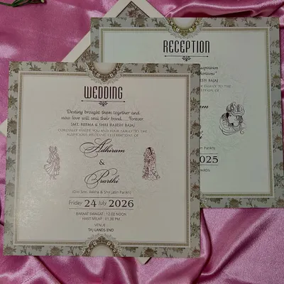 A perfect example of a complete stationery set. The wedding and reception cards share the same elegant typography, floral borders, and classic motifs for a unified look.