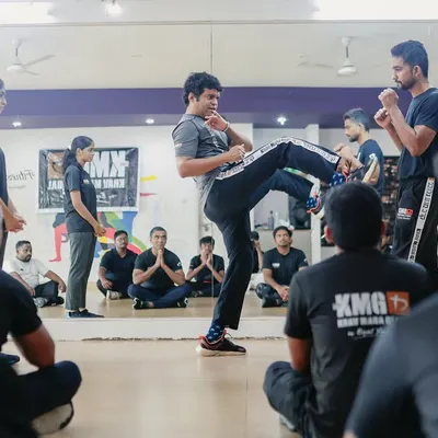 A demonstration during our Third-Party Protection Seminar in Mangalore. An instructor shows how to use combatives to intercept a threat and create a safe zone for another person.