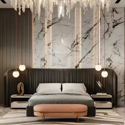 A breathtaking master bedroom design identical to our hero image, showcasing a dramatic marble accent wall and a plush, curved headboard. The combination of vertical integrated lighting and hanging globe pendants creates an atmosphere of pure luxury.