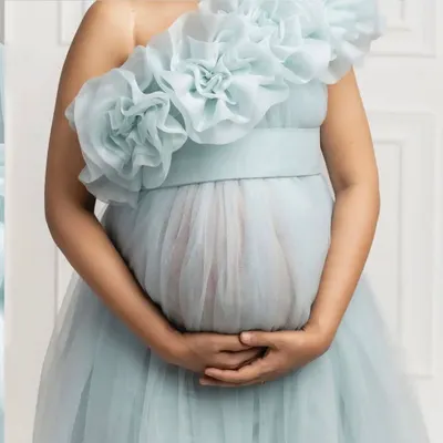 Here is a close-up of the stunning organza flower detailing on my ice blue gown. This extravagant neckline can be styled in multiple ways, making the dress both simple and incredibly special.