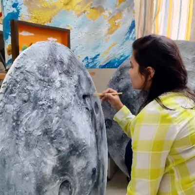 Here I am in my happy place, adding details to a new moon art piece. Capturing the magic of the moon is a creative journey I deeply enjoy, one brushstroke at a time.