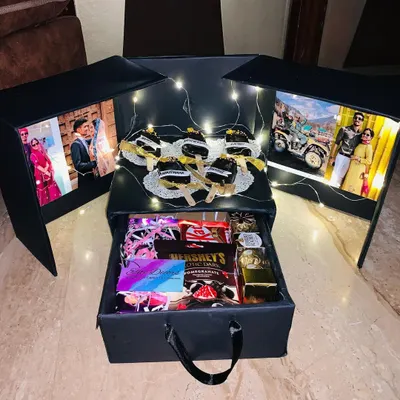 My most popular style is the surprise photo box. The side panels open to reveal backlit photos, creating a magical and personal reveal before they even see the gifts inside.