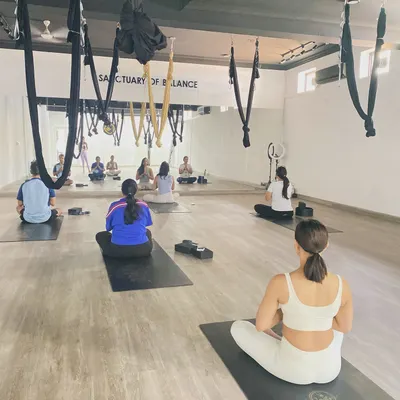 A moment of shared stillness before class begins. This collective energy sets the tone for our practice, creating a focused and peaceful environment for everyone on the mat.