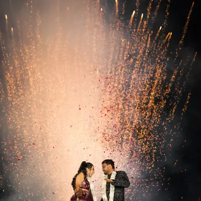 In a sky bursting with light, two hearts found their forever. We believe in capturing these grand, cinematic moments that feel like they are straight out of a movie, because your love story deserves nothing less.