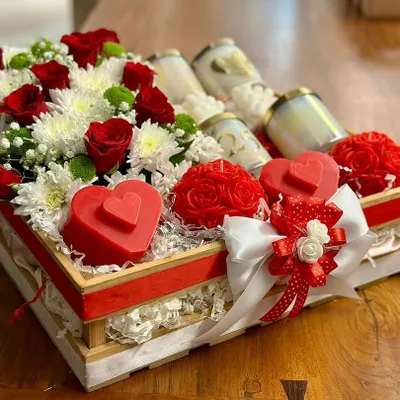 This custom hamper was a joy to create. It's overflowing with fresh red and white flowers, surrounding my heart-shaped and rose-shaped candles, along with some classic jar candles.