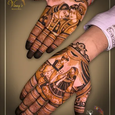 A close-up of our groom portrait work. One hand features a classic Radha-Krishna depiction, while the other captures the iconic varmala exchange, creating a beautiful narrative across both palms.