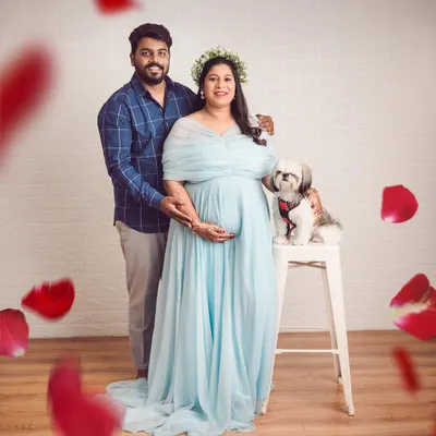 A beautiful maternity portrait including the couple's beloved dog. We believe pets are family and love having them join in to celebrate the upcoming arrival.