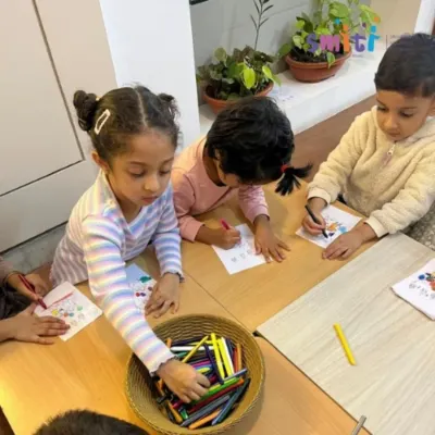 Children are deeply focused on a coloring activity for Eid Milad-un-Nabi. Art is a wonderful medium for them to learn about and express the spirit of different cultural celebrations.