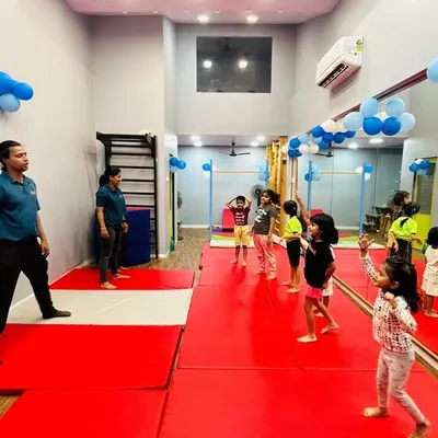 An instructor leads a group of young dancers at our Gorai center. This image shows a typical class setup where students have ample space to move and learn choreography in a structured, interactive setting.