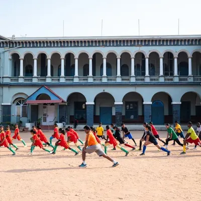 A group of young players doing warm-up lunges at our 2023 summer camp, held at the historic St. Germain Academy. Discipline and preparation are the first lessons of the day.