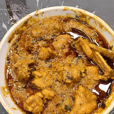A bowl of my special chicken korma, with a rich, oily gravy and tender pieces of meat. This is pure comfort food.