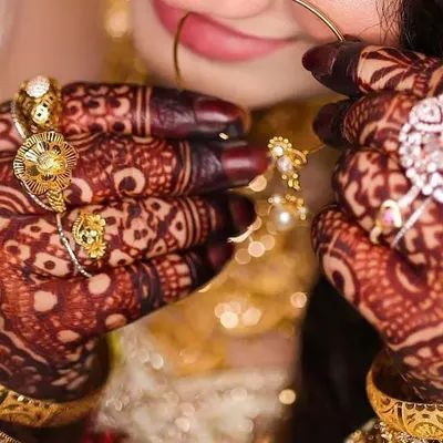 This professional shot captures the deep, rich color of the henna stain, beautifully accessorized with bridal jewelry. This is the quality I guarantee.