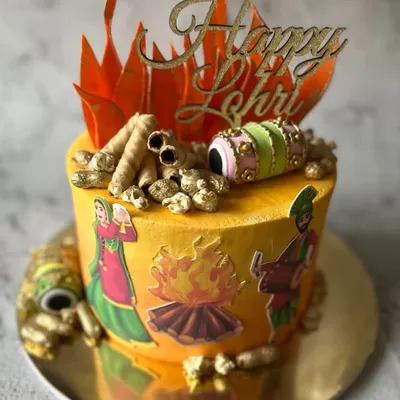 Bringing the warmth of the bonfire to your dessert table. This custom Lohri cake is decorated with edible flames, peanuts, and traditional Punjabi motifs.