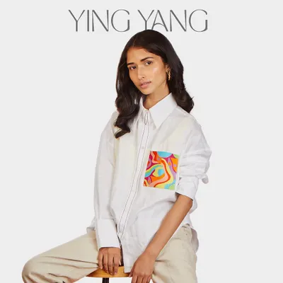 The Ying Yang oversized hemp shirt. This piece is light, soft, and features a pocket with my swirling, colorful artwork, bringing a sense of balance and artistic flair to a classic boyfriend-fit shirt.