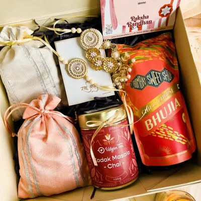 Our 'Laad Pyaar' Rakhi hamper is all about celebrating the bond between a 'bhaiya' and 'bhabhi'. It's packed with masala chai, bhujia, dry fruit potlis, and a stunning handcrafted lumba rakhi set.