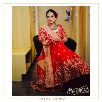 A moment of quiet reflection before the ceremony. The bride looks regal in her custom red Dabka and pearl embroidered lehenga, a design we collaborated on to match her vision perfectly.