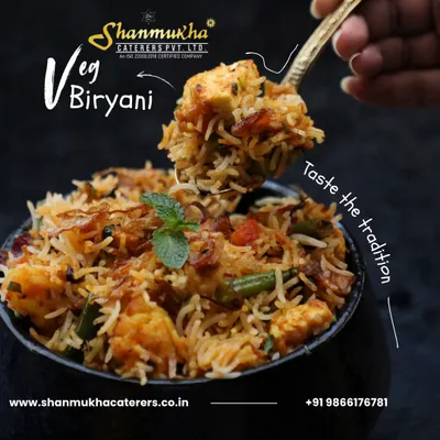 A spoonful of our delicious Veg Biryani, showcasing the perfectly cooked basmati rice, fried onions, fresh vegetables, and paneer. Taste the tradition in every bite.