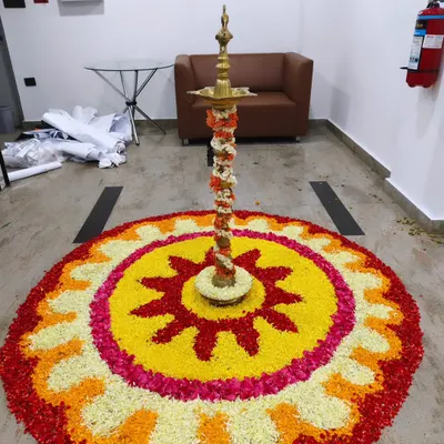 I blend tradition with modern corporate style. This intricate flower petal rangoli with a traditional brass lamp (Diya) at its center brought an auspicious and beautiful touch to the Trans cosmos office opening.