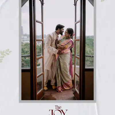 A beautiful, soft-lit portrait of a couple sharing an intimate moment on a balcony.