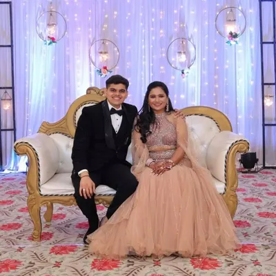 This peach fish-cut lehenga with a cape-style dupatta is a perfect fusion of modern silhouette and traditional sparkle. It’s a glamorous choice for a reception or engagement, and I also offer coordinating tuxedos for a complete couple's look.