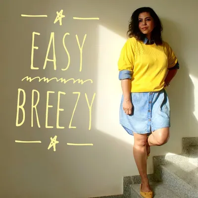 This easy, breezy look is all about comfortable, relaxed style. I have layered a bright yellow sweater over a denim shirt dress to add a pop of color and visual interest.