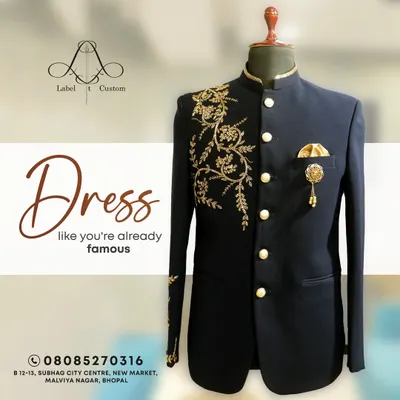Dress like you're already famous. This navy blue Jodhpuri suit with elegant gold floral embroidery on the shoulder and cuff is designed to make a powerful statement. It's a perfect example of my bespoke ethnic wear for grooms.