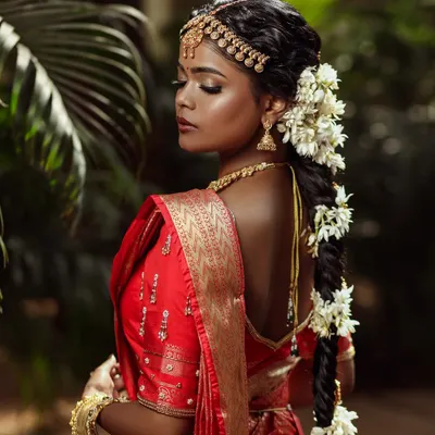 A powerful and artistic portrait of a South Indian bride. This look celebrates deep skin tones, using a dewy base and defined features to create a truly stunning result.