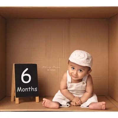 Celebrating six months with a fun 'in the box' setup. This is a wonderful way to mark a half-birthday milestone with a creative twist.