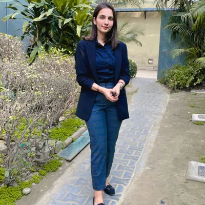 A formal portrait taken outdoors. I believe in maintaining a professional and composed appearance, as it reflects the seriousness with which I approach my work.